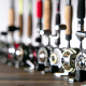 A variety of fishing reels including spinning, baitcasting, and fly fishing reels